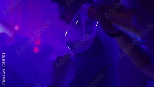 the girl pours alcohol