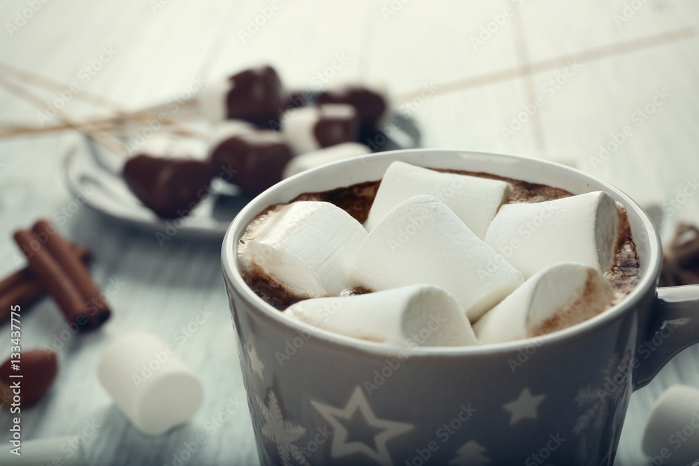 Cup of hot cocoa with marshmallows on table Cup of hot cocoa with marshmallows on table