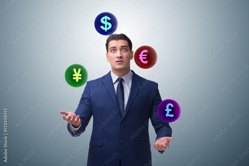 Businessman juggling between various currencies Businessman juggling between various currencies