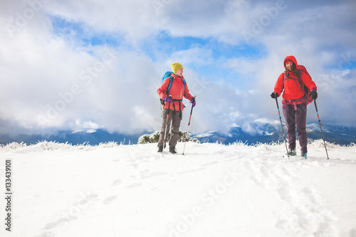 Two girls in the mountains in winter.