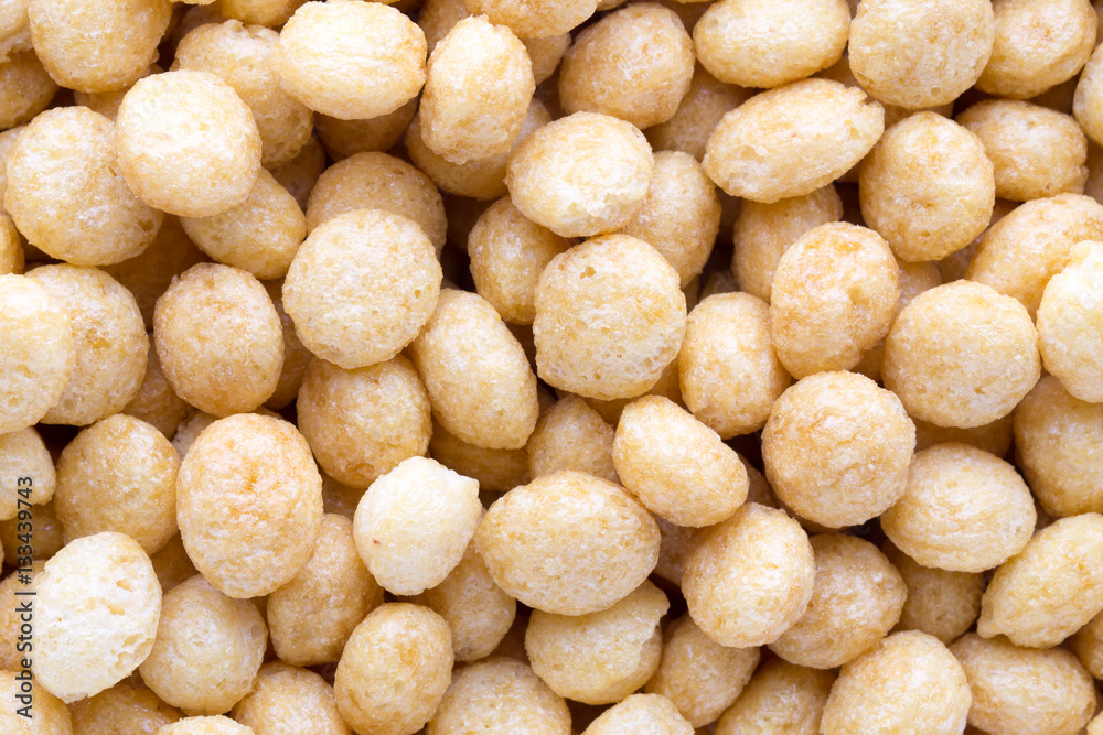 Corn flakes rings on the background.