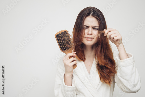 woman combs red hair, scalp care, massage