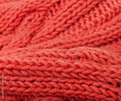 Background of red knitted fabric.