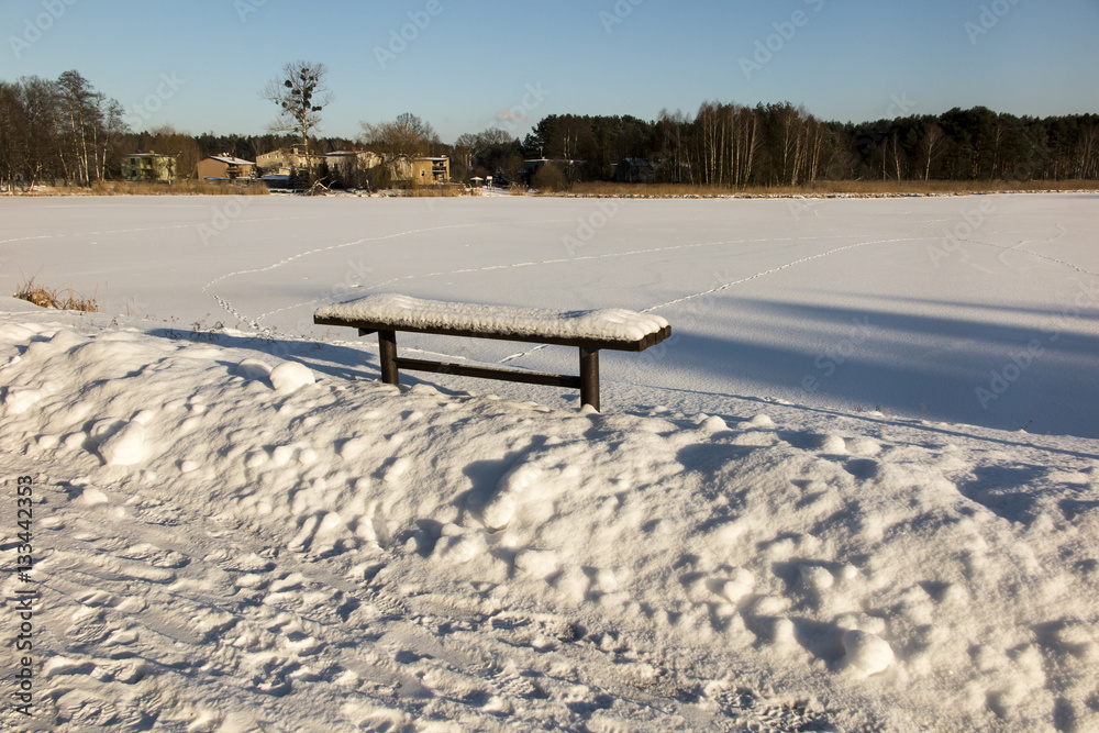 bench covered with snow