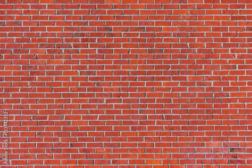 Red brick wall with many ti...