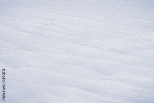 Snow covered field in closeup with soft curves