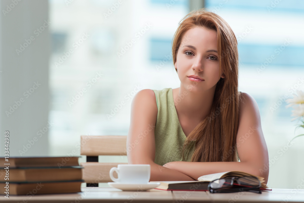 Young student preparing for exams drinking tea Young student preparing for exams drinking tea