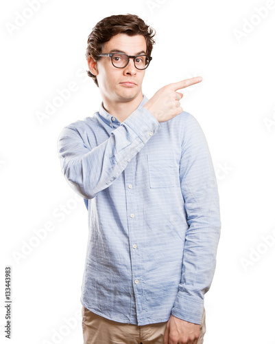 Confident young man pointing