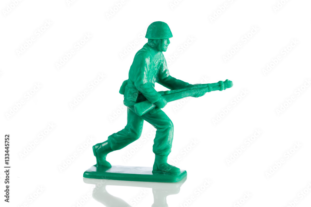 Miniature plastic toy soldier on white background Miniature plastic toy soldier on white background