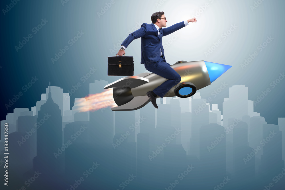 Businessman flying on rocket in business concept Businessman flying on rocket in business concept