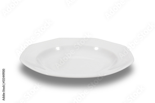 Soup deep white plate with wide shoulders and embellishment on white background from side