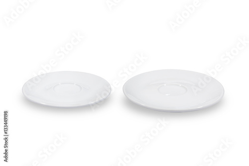 Two flat white saucers side by side smaller and bigger on white background from side