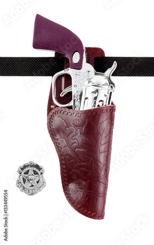 Canvas Print Plastic toy brown and silver western handgun with badge in holster
