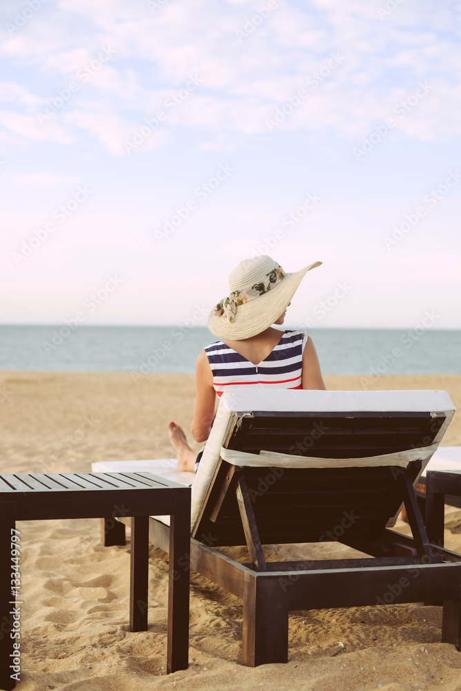 Rear view of joyful happy female on a tropical beach blue sky outside background Rear view of joyful happy female on a tropical beach blue sky outside background