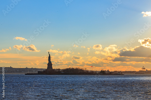 Statue of liberty with cloudscape.