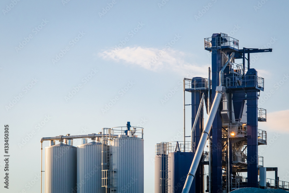 Industrial view chimneys silos and pipes Industrial view chimneys silos and pipes