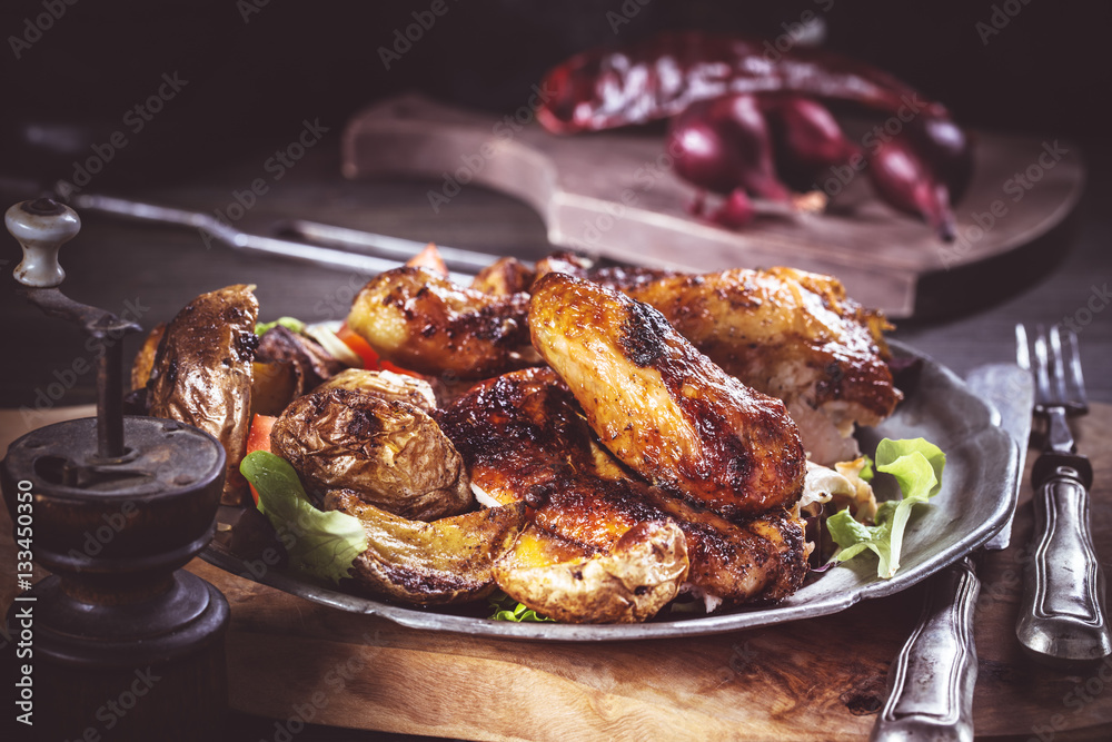 Slices of grilled chicken on plate rustic