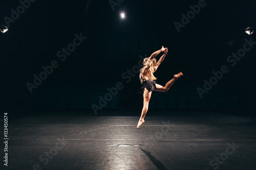 woman alone on stage doing modern dance performance © aerogondo