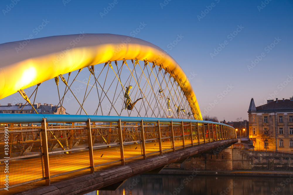 Obraz premium Bernatka footbridge over Vistula river in Krakow, Poland
