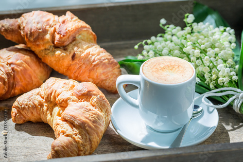 Hot coffee and delicious croissant for breakfast