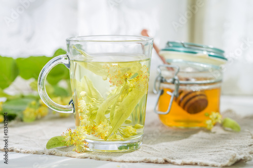 Healthy linden tea with honey in spring day