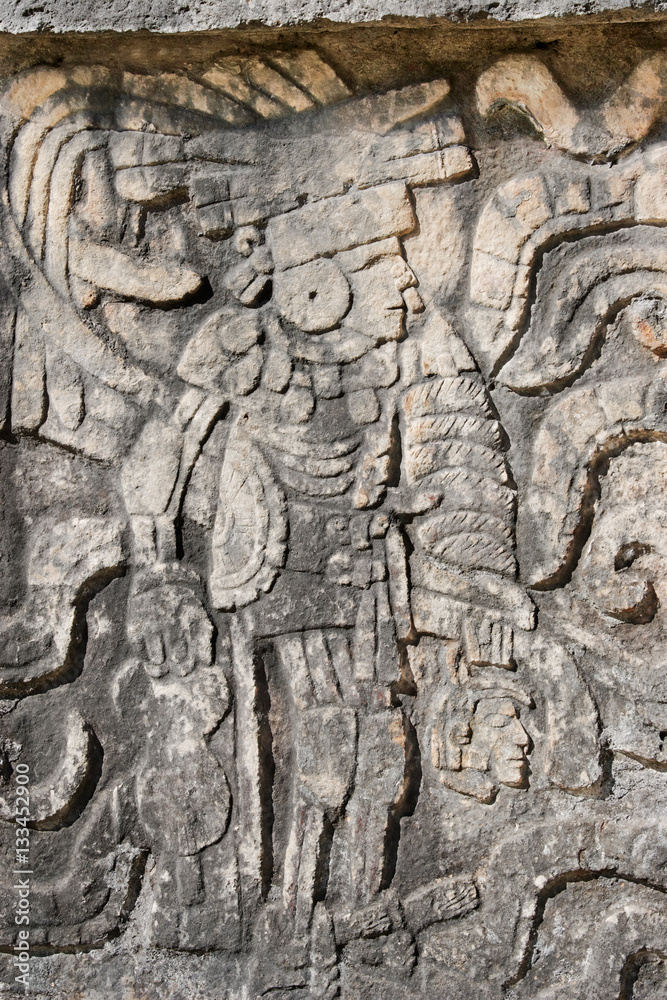 Carving at Chichen Itza showing a winner at Mayan ball game carries loser's head Carving at Chichen Itza showing a winner at Mayan ball game carries loser's head