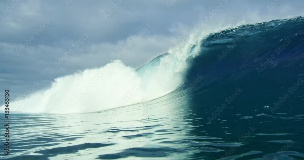 Beautiful blue ocean wave breaking in slow motion. Shot on RED in 4K