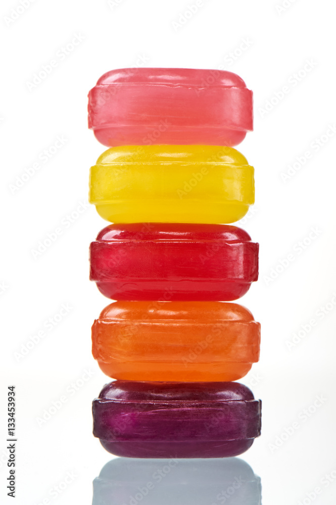 Stack colorful hard lollipop candies closeup