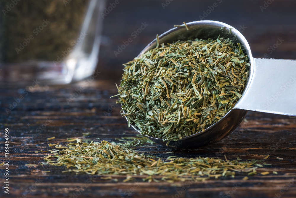 Dill Weed Spilled from a Teaspoon StockFoto Adobe Stock