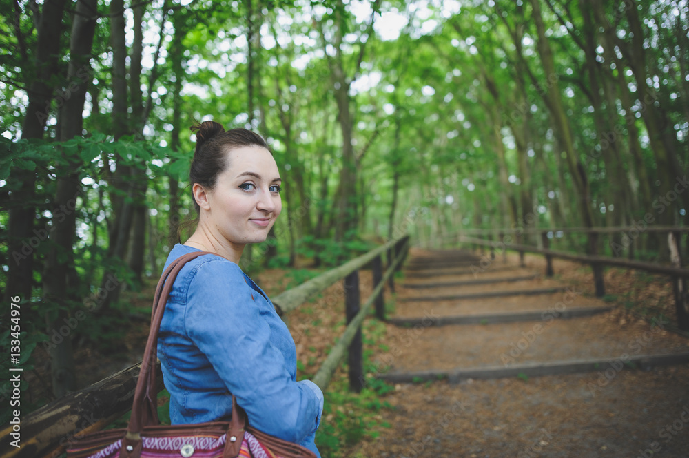 Young girl on a walk in the forest Young girl on a walk in the forest