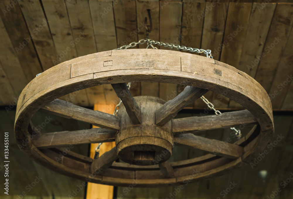 Wagon wheel hanging on the ceiling