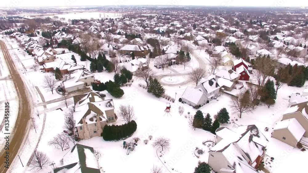 Stunning aerial view of upper class suburban neighborhood under January snow.
Stunning aerial view of upper class suburban neighborhood under January snow.