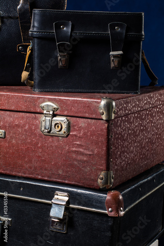 Close-up of a stack vintage shabby suitcases
