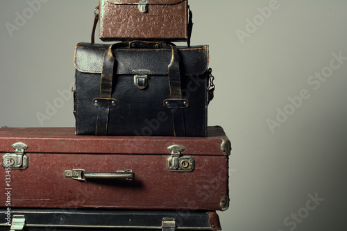 Background stack of old suitcases form a tower