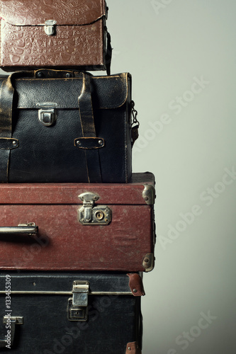 Background stack of old suitcases form a tower © kanzefar