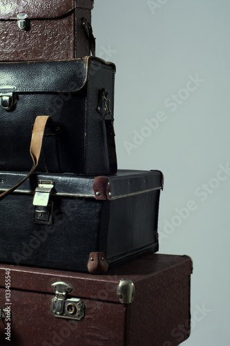 Background stack of old shabby suitcase