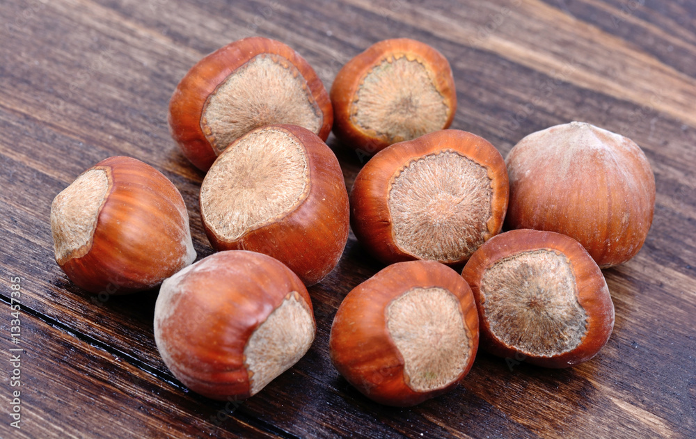 Group of hazelnuts on wooden background Group of hazelnuts on wooden background