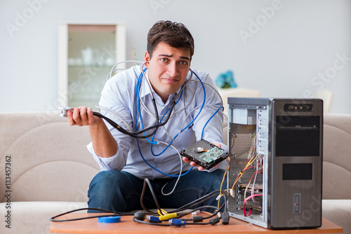 Frustrated man with broken pc computer