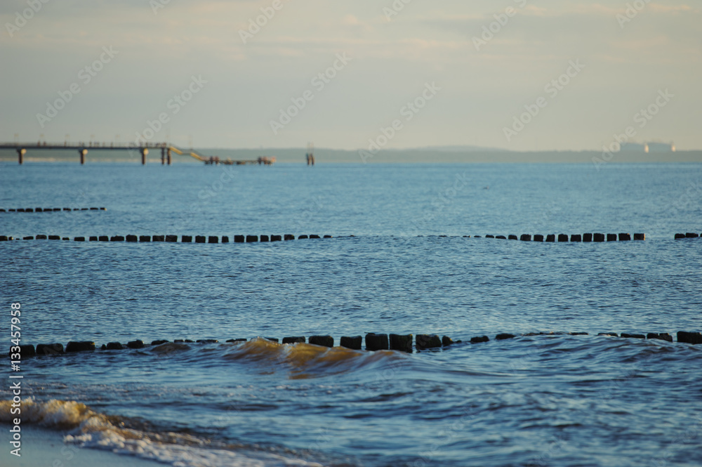 Breakwaters in the Baltic sea over the sunset Breakwaters in the Baltic sea over the sunset