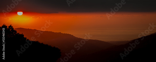 Red and Orange Sunset Over The Mountains