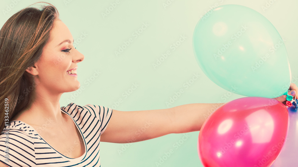 Woman summer joyful girl with colorful balloons Woman summer joyful girl with colorful balloons