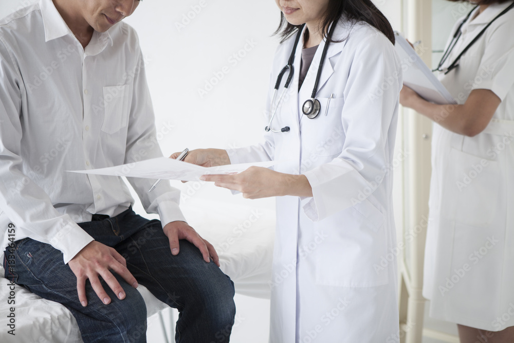 The doctor is showing the document to the patient