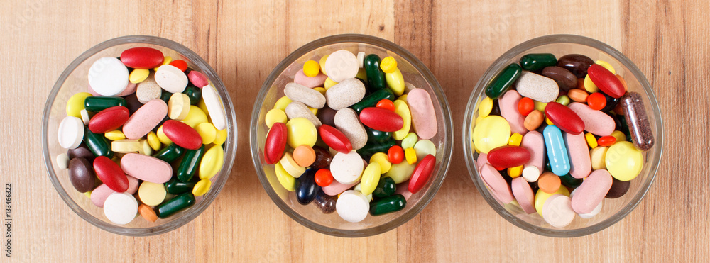 Heap of colorful medical pills and capsules, health care concept