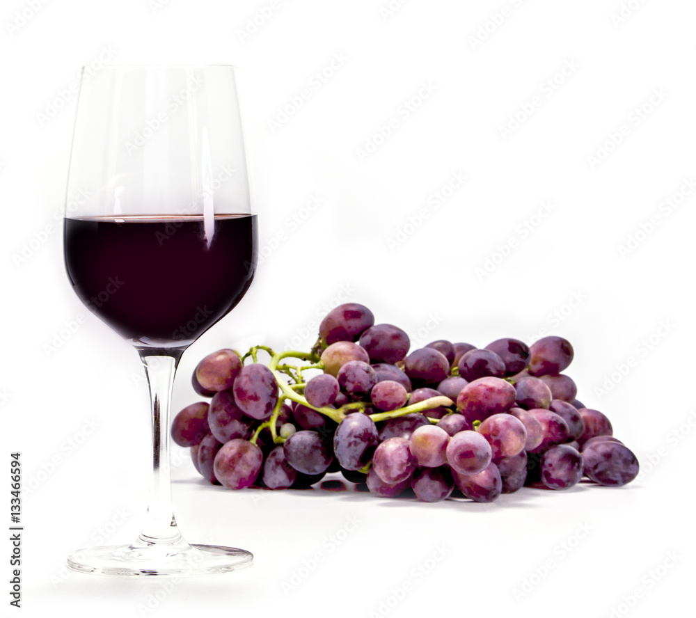 Glass of red wine with grapes Glass of red wine with grapes