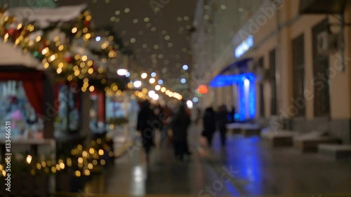 Wallpaper Mural People walking on the street in the evening, a festive illumination, out of focus Torontodigital.ca