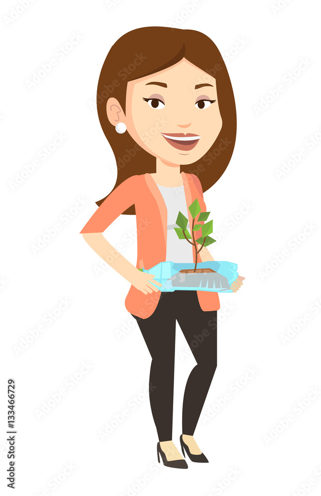 Woman holding plant growing in plastic bottle. Woman holding plant growing in plastic bottle.