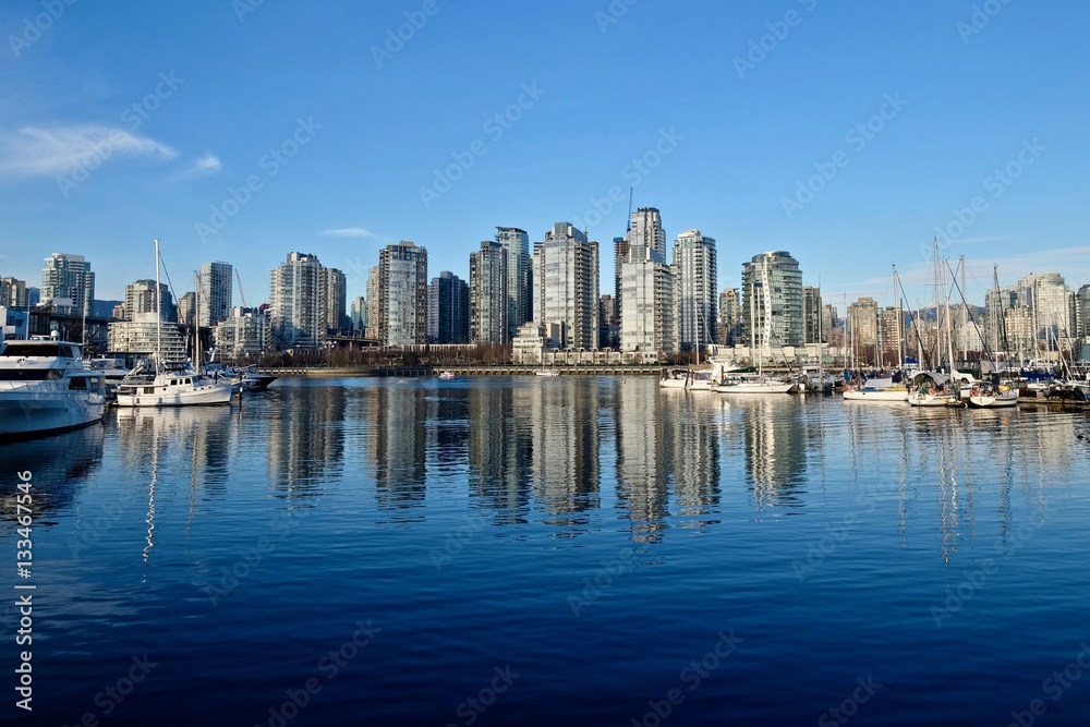 Seawall and boats in city marina. False Creek from Granville Island. Yaletown. Vancouver. British Columbica. Canada.