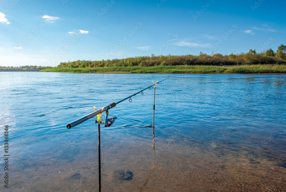 Fishing rod standing by the river