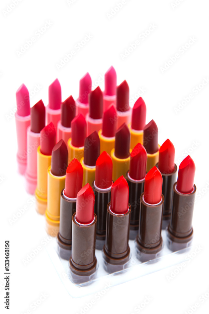 set of lipsticks red color on white background