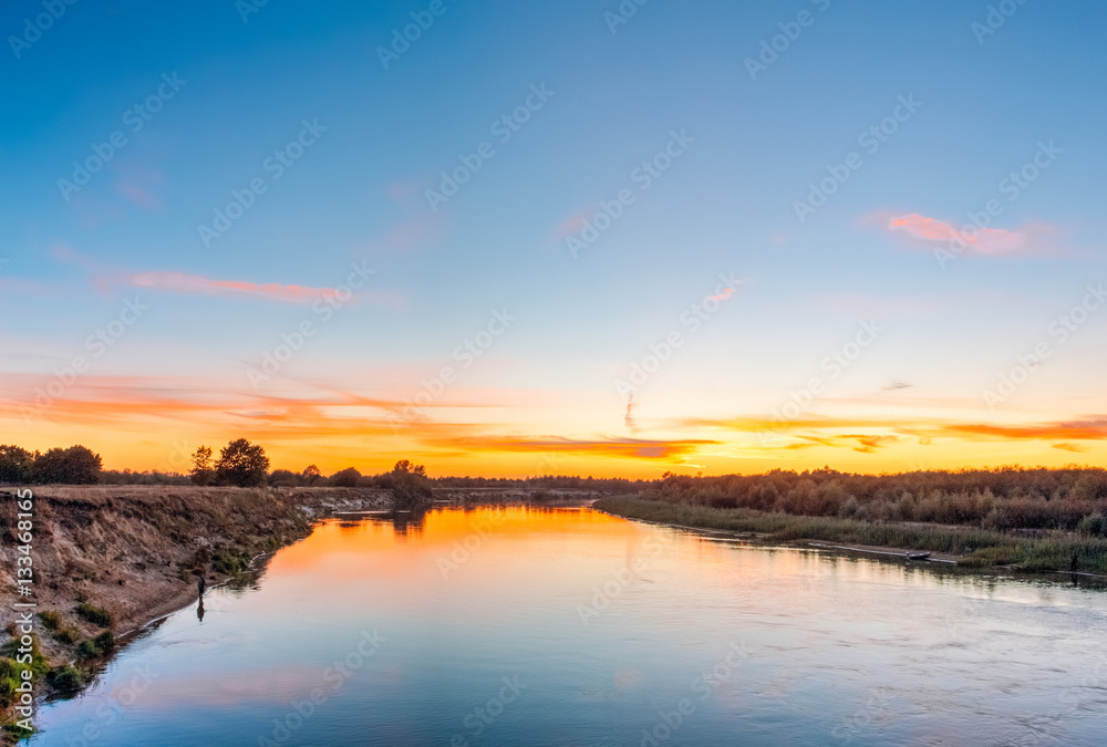Beautiful horizon over the river at sunset time